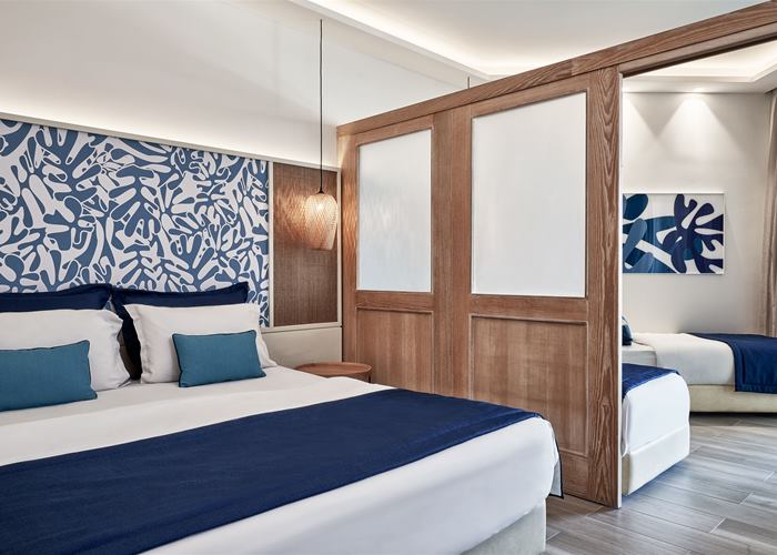 Atlantica Aegean Blue - Family Room with Sliding Doors Inland View